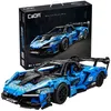 A blue and black toy car model and its packaging are displayed against a white background. Voir les images du produit