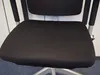 Close-up of a black office chair seat and backrest. Produktbild-Vorschau