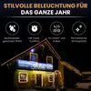 A building decorated with string lights at night. Produktbild-Vorschau