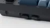 A close-up view of the side of a black mechanical keyboard, showing a small switch and a Keychron logo. Anteprima dell’immagine prodotto