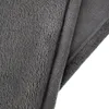 A close-up view of a folded grey blanket. Produktbild-Vorschau