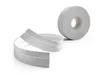 A roll of flexible PVC baseboard trim with a wood-like texture is shown, with a portion unrolled and curved. Anteprima dell’immagine prodotto