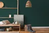 A cozy living room scene with a daybed, artwork, and decorative baskets. Produktbild-Vorschau