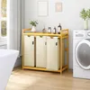 A laundry basket with three compartments on a wooden shelf, next to a washing machine in a laundry room. Anteprima dell’immagine prodotto