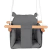 A close-up view of a gray baby swing with wooden bars, suspended by white ropes. Produktbild-Vorschau