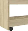 A close-up view of the bottom corner of a narrow storage cart with wheels. Podgląd zdjęcia produktu