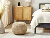 A bedroom scene featuring a pouf, a cabinet, and a bed. Náhled obrázku produktu