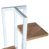A close-up view of a white metal shelf with a wooden shelf. Anteprima dell’immagine prodotto