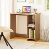 A small wooden desk with a laptop, clock, and books, placed in a room with a chair and a window. Náhľad obrázku produktu