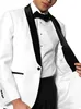 A man wearing a white tuxedo with black lapels and a black bow tie. Produktbild-Vorschau