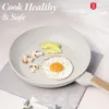 A frying pan with food items inside, presented in a clean, well-lit setting. Náhled obrázku produktu