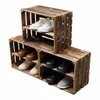 A set of wooden crates used as a shoe rack, displaying various shoes. Náhled obrázku produktu