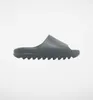 A single slide sandal is shown against a white background. Produktbild-Vorschau