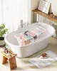 A small, foldable drying rack with clothes is placed inside a bathtub in a bathroom. Produktbild-Vorschau