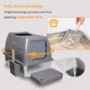 A grey and silver enclosed cat litter box with a scoop and a mat, shown with marketing text and diagrams. Náhľad obrázku produktu