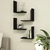 Four black L-shaped shelves mounted on a light-colored wall, with decorative items and books on them. Podgląd zdjęcia produktu