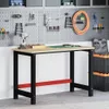 A workbench and pegboard in a garage or workshop setting. Voir les images du produit