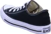 A black Converse All Star shoe is shown from the side. Voir les images du produit