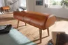A leather bench with wooden legs in a room with a turntable and books. Náhľad obrázku produktu