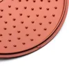 A close-up view of the textured surface of a copper-colored pan. Produktbild-Vorschau
