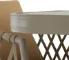 A close-up view of a table and chair from a patio furniture set. Produktbild-Vorschau