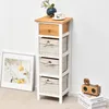 A narrow wooden chest of drawers with three woven baskets and one drawer, placed against a white wall next to a framed picture. Podgląd zdjęcia produktu