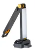 A black and yellow adjustable work light with a white LED panel, shown on a white background. Produktbild-Vorschau