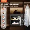 A safe box is shown inside a closet, with clothes hanging in the background and various items displayed inside the safe. Produktbild-Vorschau