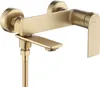 A gold-colored bathroom faucet with a shower hose attachment, shown against a white background. Produktbild-Vorschau