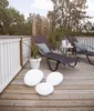 A deck with lounge chairs and decorative lights. Náhled obrázku produktu