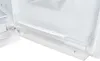 Close-up of the inside of a refrigerator, showing a clear plastic drawer and a white shelf. Produktbild-Vorschau