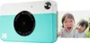 A Kodak instant print camera with a photo of two children being printed. Podgląd zdjęcia produktu