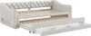 A beige upholstered daybed with a pull-out trundle bed and storage drawers, shown with the trundle extended. Voir les images du produit