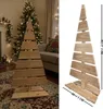 A wooden Christmas tree alternative is shown in two views: one in a room setting with a decorated Christmas tree in the background, and another isolated view with dimensions indicated. Podgląd zdjęcia produktu