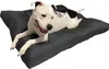 A dog is lying on a dog bed. Produktbild-Vorschau