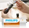 A person is inserting a battery into a flashlight. Produktbild-Vorschau