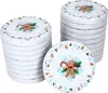 Stacks of round lids with a Christmas gingerbread man design. Produktbild-Vorschau