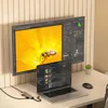 A laptop and a large monitor are set up on a desk, connected by a USB-C hub. Náhled obrázku produktu