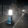 A construction site at night, with a portable LED light illuminating the area. Anteprima dell’immagine prodotto