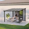 A patio area with a modern pergola, outdoor furniture, and a plant. Produktbild-Vorschau