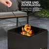 A hand using a poker to tend a fire in a square fire pit on a patio. Produktbild-Vorschau