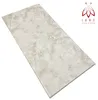 A single, rectangular panel with a marble-like pattern, presented at an angle on a white background. A logo and text are visible in the top right corner. Produktbild-Vorschau