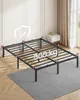 A metal bed frame is shown in a room with a rug, nightstand, and window. Náhled obrázku produktu