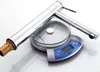 A chrome faucet is placed on a digital scale. Podgląd zdjęcia produktu