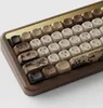 A close-up view of a mechanical keyboard with a wooden case and decorative keycaps. Produktbild-Vorschau