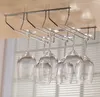 A metal rack holding several wine glasses, mounted under a wooden surface. Produktbild-Vorschau