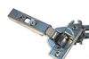A close-up shot of a cabinet hinge against a white background. Produktbild-Vorschau