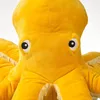 A close-up of a yellow plush octopus toy. Anteprima dell’immagine prodotto