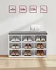 A white shoe cabinet with a gray upholstered top and various shoes stored inside. Produktbild-Vorschau