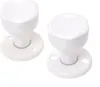 Two white door knobs with rosettes are shown against a white background. Anteprima dell’immagine prodotto